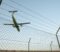 Plane behind security fence