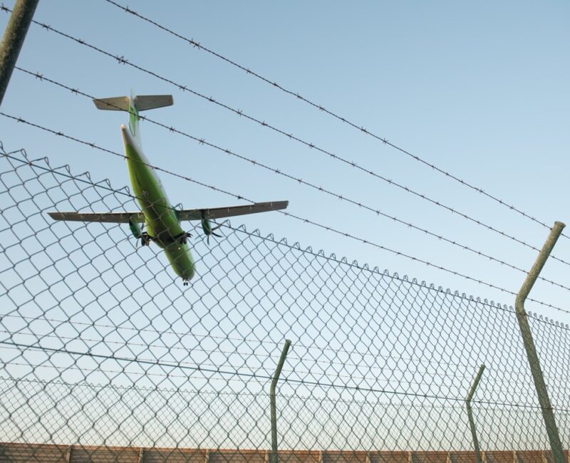 Plane behind security fence